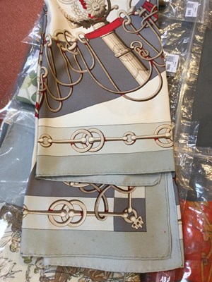 Lot 574 - A 'Cliquetis' silk scarf by Hermès, designed...