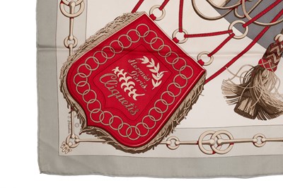 Lot 574 - A 'Cliquetis' silk scarf by Hermès, designed...