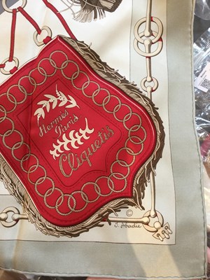 Lot 574 - A 'Cliquetis' silk scarf by Hermès, designed...