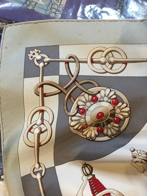 Lot 574 - A 'Cliquetis' silk scarf by Hermès, designed...