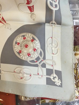 Lot 574 - A 'Cliquetis' silk scarf by Hermès, designed...