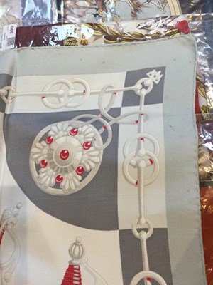 Lot 574 - A 'Cliquetis' silk scarf by Hermès, designed...