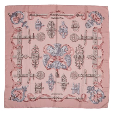 Lot 595 - A 'Ferronnnerie' silk scarf by Hermès,...