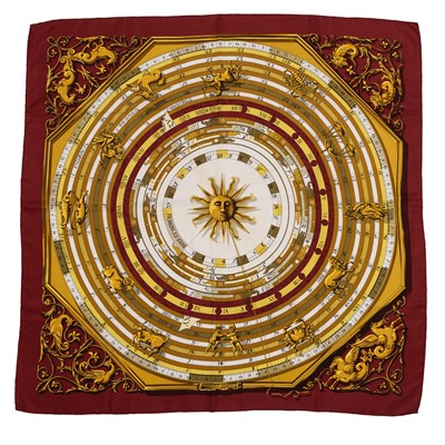 Lot 576 - An 'Astrologie Forever' silk scarf by Hermès,...