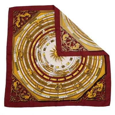 Lot 576 - An 'Astrologie Forever' silk scarf by Hermès,...