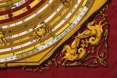Lot 576 - An 'Astrologie Forever' silk scarf by Hermès,...