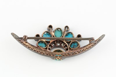 Lot 284 - A turquoise and diamond crescent brooch, set...
