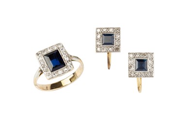 Lot 166 - A sapphire and diamond cluster ring, the...