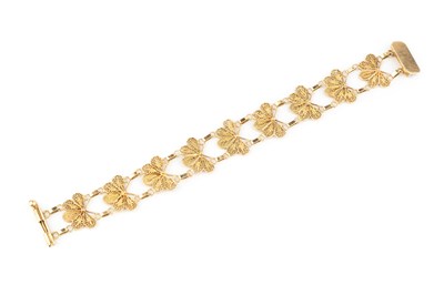 Lot 5 - A fancy-link bracelet, designed as a series of...