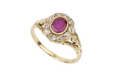 Lot 317 - A ruby and diamond cluster ring, the oval cut...