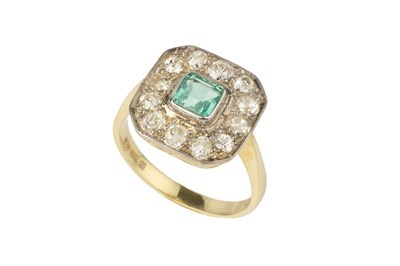 Lot 105 - An emerald and diamond cluster ring, of...