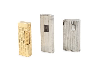 Lot 573 - A Dunhill gold plated lighter, of rectangular...