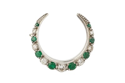 Lot 108 - An emerald and diamond crescent brooch, set...