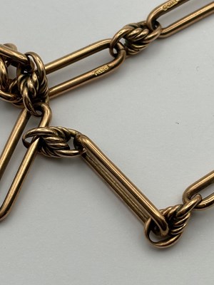 Lot 69 - A 9ct gold Albert chain, composed of alternate...