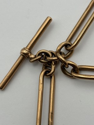 Lot 69 - A 9ct gold Albert chain, composed of alternate...