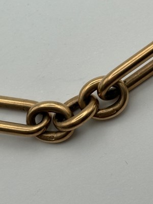 Lot 69 - A 9ct gold Albert chain, composed of alternate...