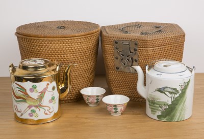 Lot 192 - Two wicker work baskets incorporating teapots...