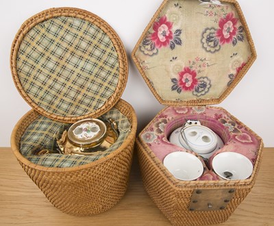 Lot 192 - Two wicker work baskets incorporating teapots...