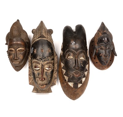 Lot 104 - A group of four Baule masks, Ivory coast, the...