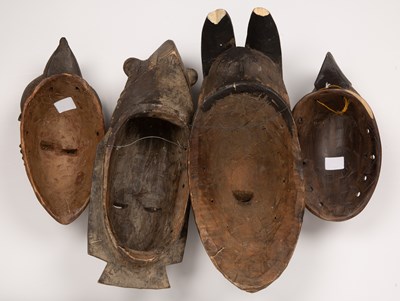 Lot 104 - A group of four Baule masks, Ivory coast, the...
