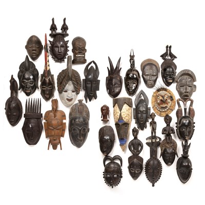 Lot 107 - A collection of 26 African Tribal masks