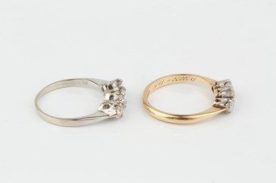 Lot 213 - A diamond three stone ring, the graduated...