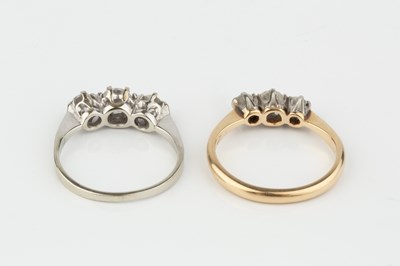 Lot 213 - A diamond three stone ring, the graduated...