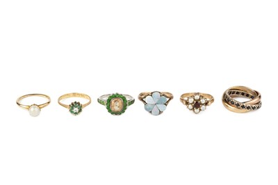 Lot 124 - A gem set Russian wedding band, inset with a...