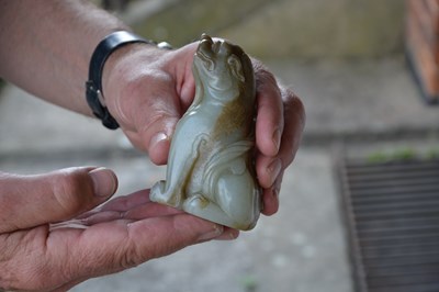Lot 152 - Mythical pale green jade model of a beast...