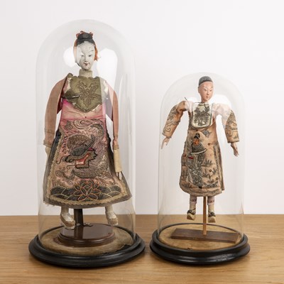 Lot 369 - Two wooden dolls under glass domes Chinese to...