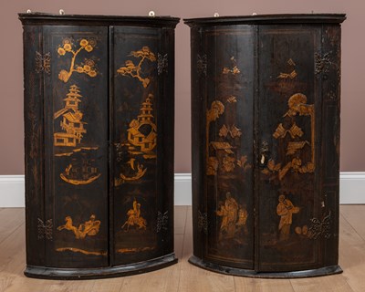 Lot 99 - A matched pair of Georgian black lacquered chinoiserie corner cabinets