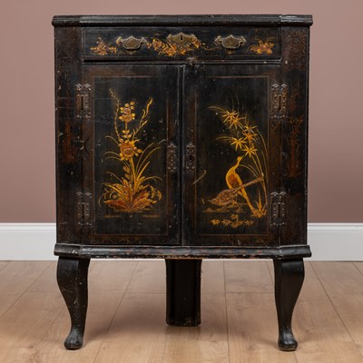 Lot 90 - A lacquered floor standing corner cupboard