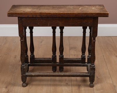 Lot 75 - A small 17th or 18th century oak fold-over gateleg table