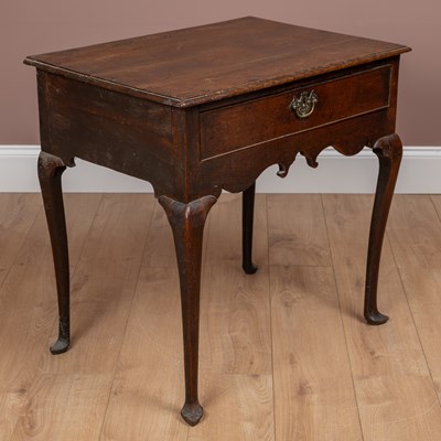 Lot 9 - An early 18th century oak single drawer side table