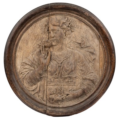 Lot 21 - A three-plank oak relief carved roundel