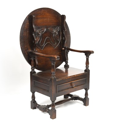 Lot 27 - An early 20th century oak monks seat, the...