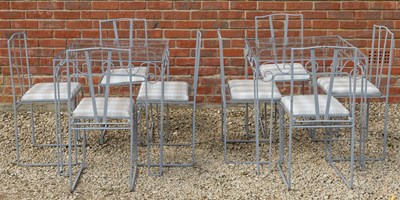 Lot 1282 - A 1920s wrought iron garden table and eight chairs