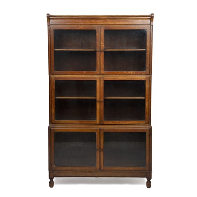 Lot 237 - A Minty style three-tier oak bookcase with...