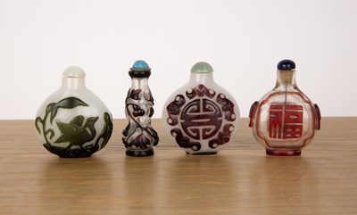 Lot 253 - Four Peking glass snuff bottles Chinese...