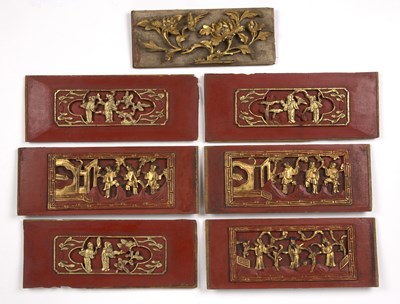 Lot 437 - Seven temple carvings Chinese of red ground...