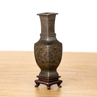 Lot 240 - Miniature bronze inlaid archaic form vessel...