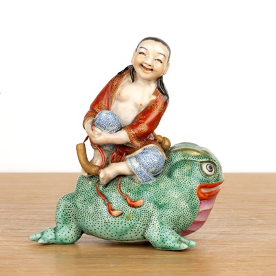 Lot 156 - Porcelain model of a boy on a toad Chinese,...