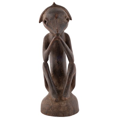 Lot 99 - An African carved tribal seated figure 12cm...