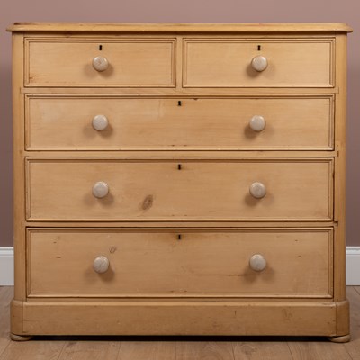 Lot 83 - A 20th century pine chest of two short over three long drawers