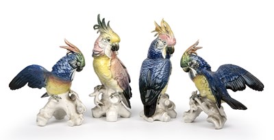 Lot 169 - Four continental porcelain cockatoos, the...