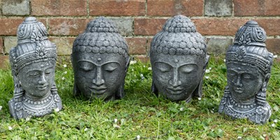 Lot 1333 - Two pairs of cast stone Buddha heads