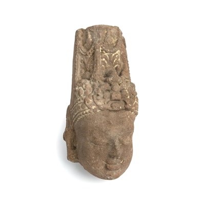 Lot 128 - An ancient Indian sandstone head of a Deity...