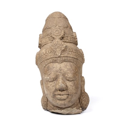 Lot 129 - An Indian carved stone head 14cm wide 29cm high