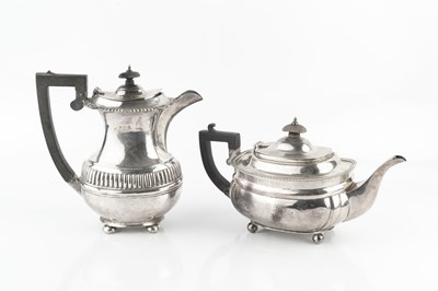 Lot 284 - A George V silver teapot, with gadrooned...