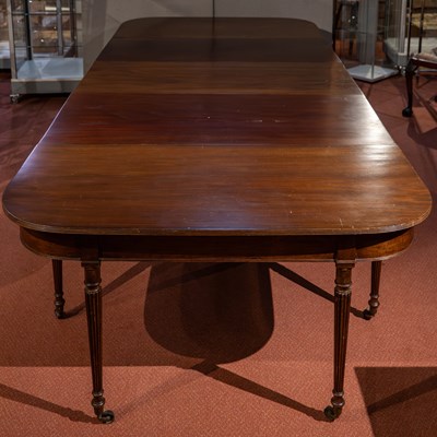 Lot 262 - A George III and later extending dining table...